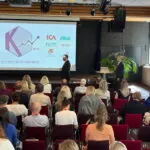 Presentation om Konsumtionsprognosrådet för publik i konferensrum med KPR-logotyp och samarbetspartners på skärm